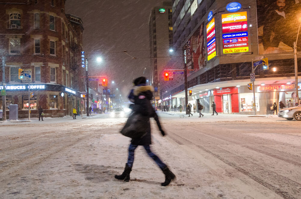 Woman Walks in Toronto Winter Storm